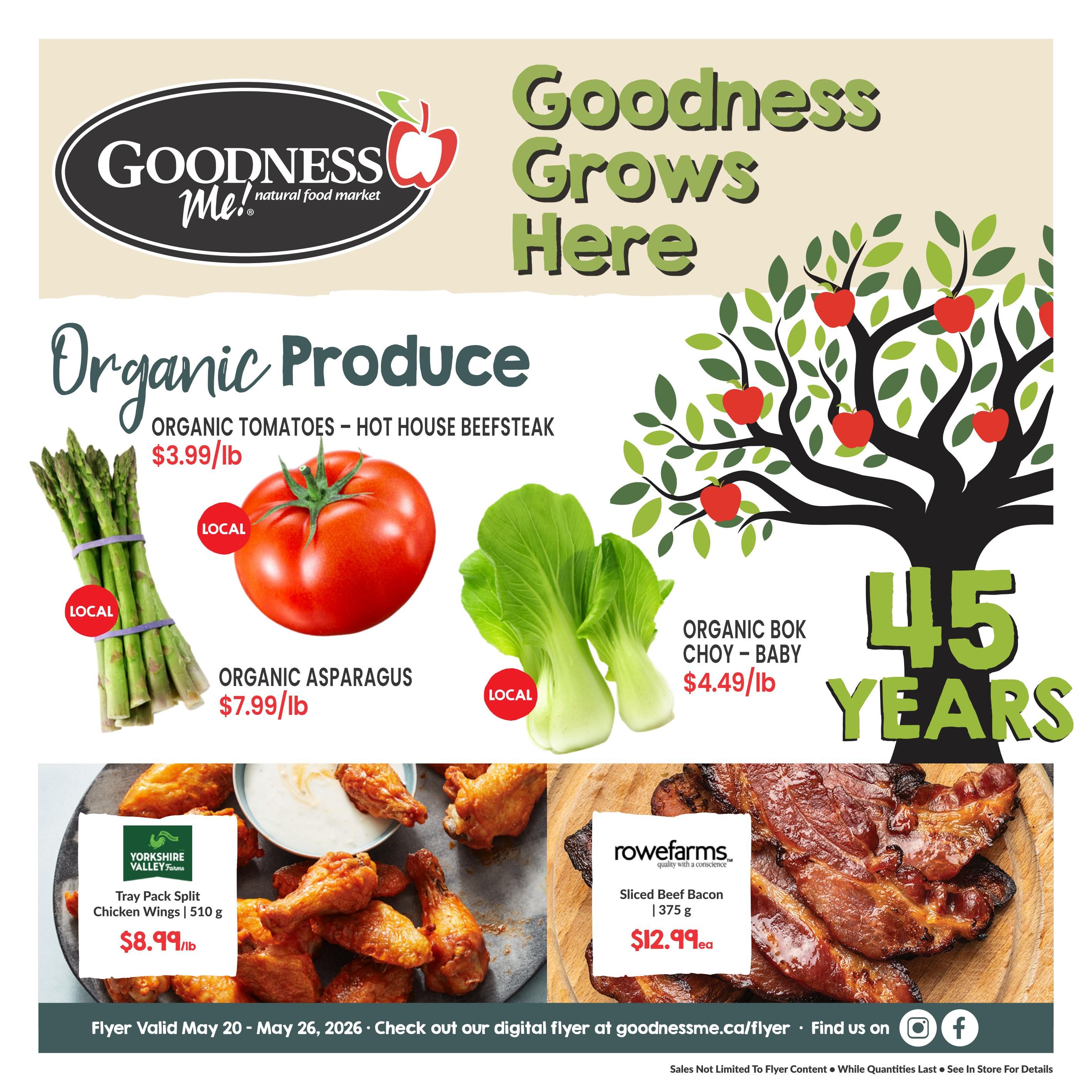 Goodness Me! flyer featuring organic produce and meat specials. Organic tomatoes - hot house beefsteak are $3.99/lb. Local organic asparagus is $7.99/lb. Local organic bok choy - baby is $4.49/lb. Yorkshire Valley Farms tray pack split chicken wings, 510 g, are $8.99/lb. Rowefarms sliced beef bacon, 375 g, is $12.99 each. The flyer is valid from May 20 to May 26, 2026. Goodness Me! is celebrating 45 years.