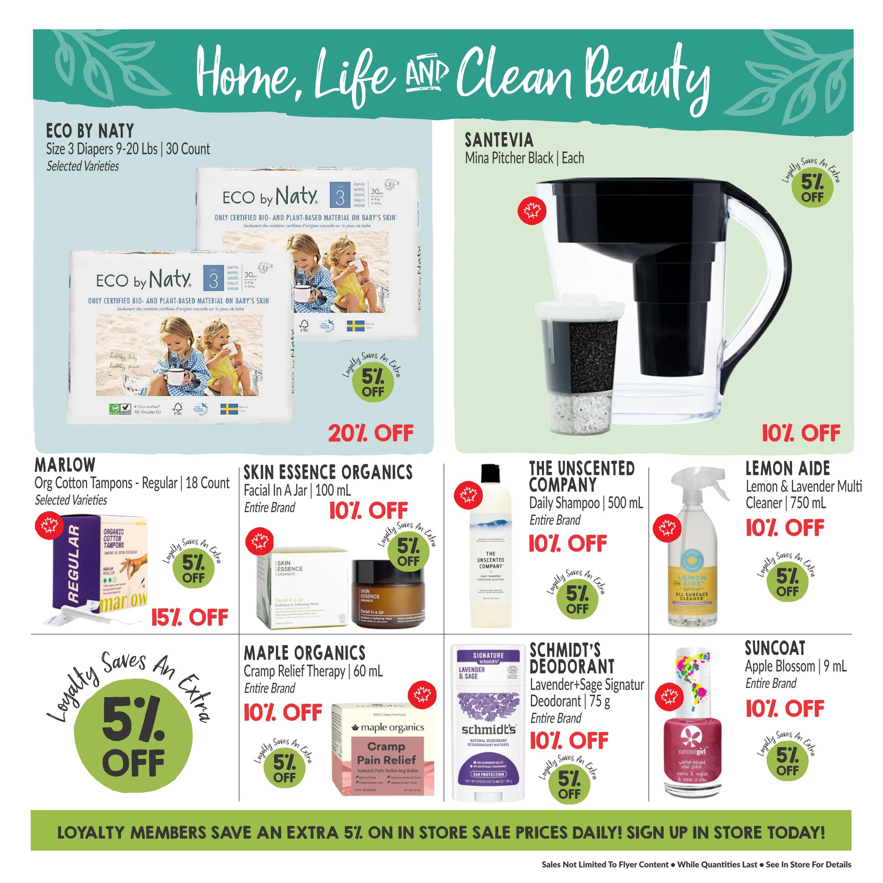 Goodness Me! flyer page 18 featuring home, life, and clean beauty products. Offers include ECO by Naty Size 3 Diapers (9-20 lbs, 30 count) with 20% off, and SANTEVIA Mina Pitcher Black with 5% off for loyalty members. Also available are MARLOW Org Cotton Tampons (18 count) with 15% off and an extra 5% off for loyalty members, SKIN ESSENCE ORGANICS Facial In A Jar (100 mL) with 10% off and an extra 5% off for loyalty members, THE UNSCENTED COMPANY Daily Shampoo (500 mL) with 10% off and an extra 5% off for loyalty members, LEMON AIDE Lemon & Lavender Multi Cleaner (750 mL) with 10% off and an extra 5% off for loyalty members, MAPLE ORGANICS Cramp Relief Therapy (60 mL) with 10% off and an extra 5% off for loyalty members, SCHMIDT'S DEODORANT Lavender+Sage Signature (75 g) with 10% off and an extra 5% off for loyalty members, and SUNCOAT Apple Blossom Nail Polish (9 mL) with 10% off and an extra 5% off for loyalty members. Loyalty members save an extra 5% on in-store sale prices daily. Sign up in store today.