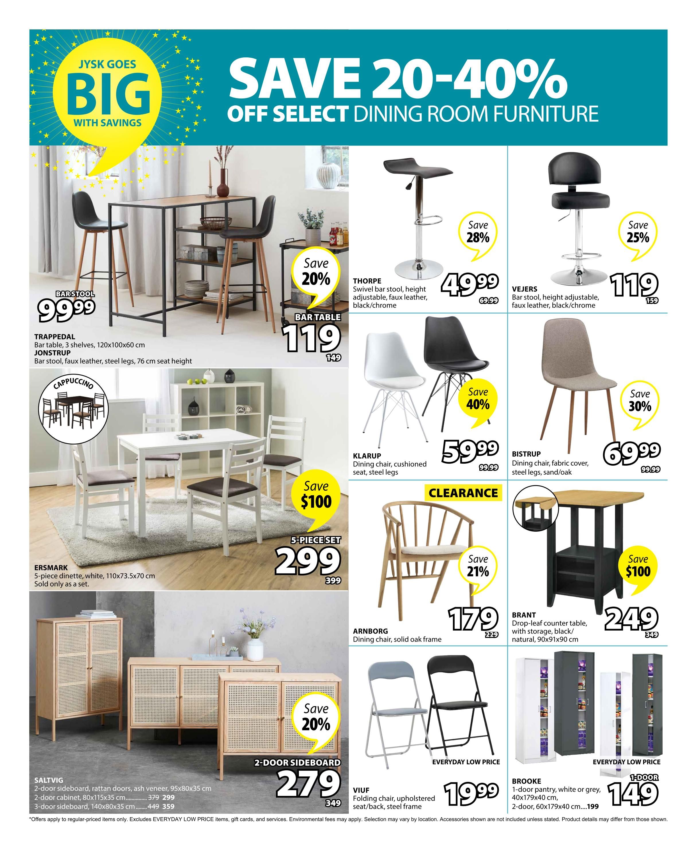 Jysk flyer page 8 features savings of 20-40% off select dining room furniture. Featured items include the TRAPPEDAL bar table for $119 (save 20%), originally $149. The JONSTRUP bar stool is $99.99. The THORPE swivel bar stool is on sale for $49.99 (save 28%), originally $69.99. The VEJERS bar stool is $119, originally $159 (save 25%). The KLARUP dining chair is $59.99 (save 40%), originally $99.99. The BISTRUP dining chair is $69.99 (save 30%), originally $99.99. The ERSMARK 5-piece dinette in white is $299 (save $100), originally $399. The ARNBORG dining chair with a solid oak frame is $179 (save 21%), originally $229. The BRANT drop-leaf counter table with storage is $249 (save $100), originally $349. The VIUF folding chair with upholstered seat/back and steel frame is an everyday low price of $19.99. The SALT VIG 2-door sideboard with rattan doors and ash veneer is $279 (save 20%), originally $349. The BROOKE 1-door pantry in white or grey is an everyday low price of $149.