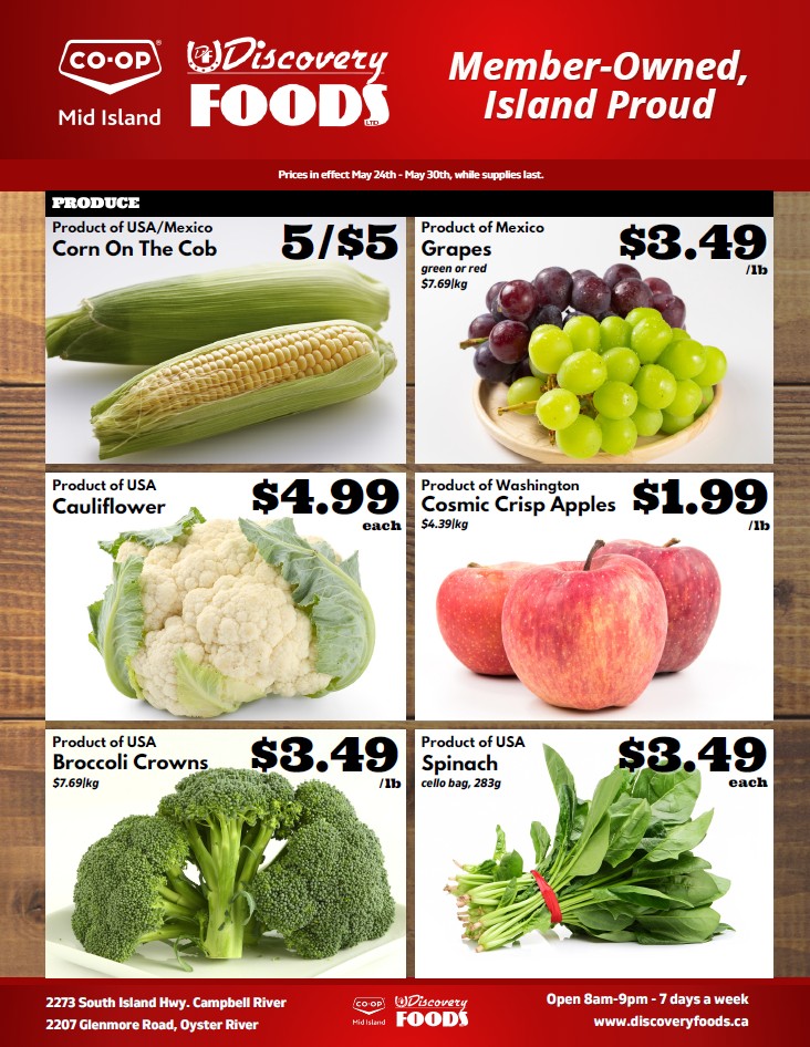 Discovery Foods weekly flyer specials page 2. Featured produce includes Corn on the Cob from USA/Mexico for 5 for $5, green or red Grapes from Mexico for $3.49 per lb, USA Cauliflower for $4.99 each, and Washington Cosmic Crisp Apples for $1.99 per lb. Also available are USA Broccoli Crowns for $3.49 per lb and USA Spinach in a cello bag (283g) for $3.49 each. Prices are effective May 24th to May 30th, while supplies last. Discovery Foods is located at 2273 South Island Hwy, Campbell River and 2207 Glenmore Road, Oyster River. They are open 8am-9pm, 7 days a week. Visit www.discoveryfoods.ca for more information.