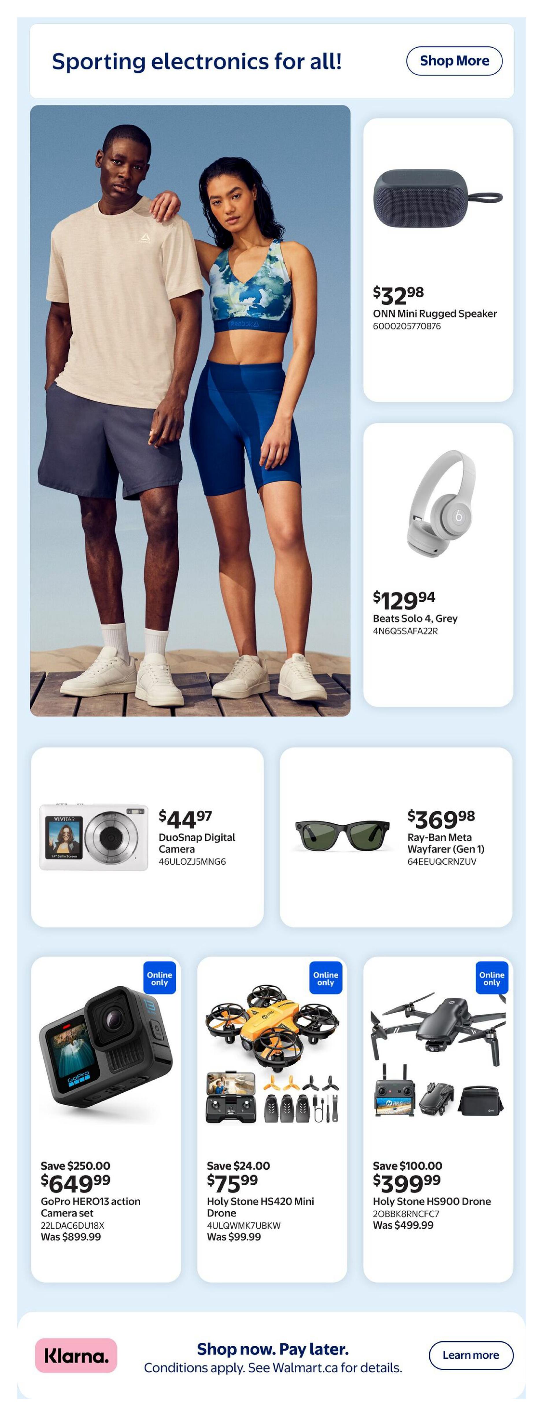 Walmart Canada flyer page 14 featuring sporting electronics. Includes an ONN Mini Rugged Speaker for $32.98, Beats Solo 4 Grey headphones for $129.94, a Vivitar DuoSnap Digital Camera for $44.97, and Ray-Ban Meta Wayfarer (Gen 1) sunglasses for $369.98. Also features a GoPro HERO13 action camera set on sale for $649.99 (was $899.99), saving $250.00. Additionally, a Holy Stone HS420 Mini Drone is available for $75.99 (was $99.99), saving $24.00. A Holy Stone HS900 Drone is on sale for $399.99 (was $499.99), saving $100.00. All drone offers are online only. The page also promotes Klarna for 'Shop now. Pay later.' options.