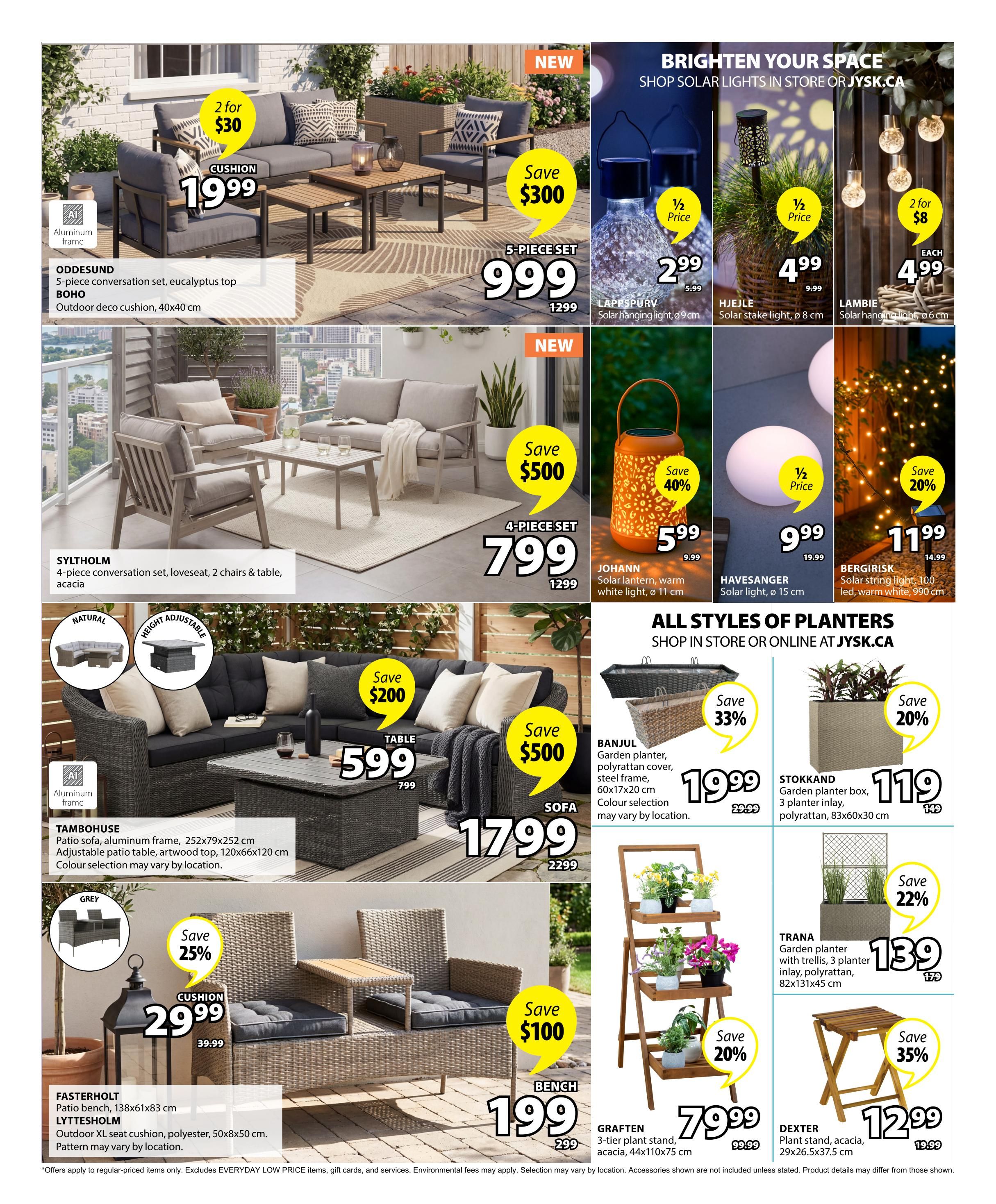 Jysk flyer page 4 features outdoor furniture and garden decor. The ODDESUND 5-piece conversation set with aluminum frame and eucalyptus top is $1999, with cushions available for 2 for $30. The SYLTHOLM 4-piece conversation set with loveseat, 2 chairs, and table made of acacia is also shown. The TAMBOHUSE patio sofa with aluminum frame, artwood top, and adjustable patio table (252x79x252 cm) is $1799, with a table option for $599 (originally $799). Cushions for the patio sofa are $29.99 (originally $39.99), a 25% saving. New arrivals include the JOHANN solar lantern for $5.99 (save 40%), HAVESANGER solar light for $9.99 (half price), and BERGIRISK solar string light for $11.99 (save 20%). Planters include the BANJUL garden planter for $19.99 (save 33%), STOKKAND garden planter box for $119 (save 20%), and TRANA garden planter with trellis for $139 (save 22%). The GRAFTEN 3-tier plant stand is $79.99 (save 20%), and the DEXTER plant stand of acacia is $12.99 (save 35%).