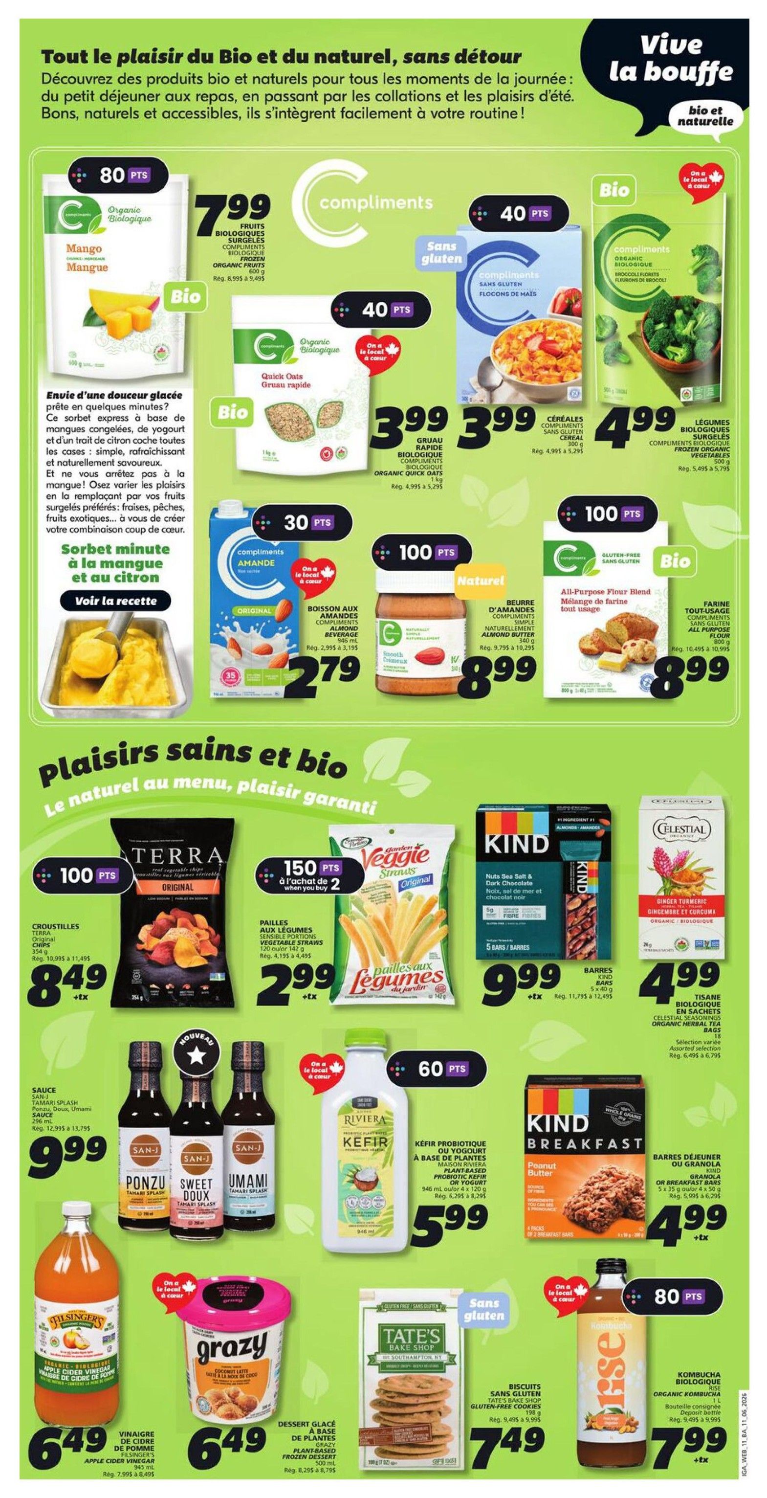 IGA weekly flyer specials page 15 features a variety of organic and natural products. Highlights include Compliments Organic Mangoes for $7.99, Compliments Organic Frozen Fruits for $7.99, and Compliments Organic Quick Oats for $3.99. Also featured are Compliments Organic Frozen Broccoli Florets for $4.99, Compliments Almond Beverage for $2.79, and Compliments Natural Almond Butter for $8.99. For gluten-free options, there are Compliments Gluten-Free Corn Flakes for $3.99 and Compliments All-Purpose Flour Blend for $8.99. The flyer also showcases Terra Original Vegetable Chips for $8.49, Veggie Straws for $2.99 when you buy 2, and Kind Breakfast Bars for $4.99. Other deals include San-J Tamari Splash Sauces for $9.99, Riviera Kefir for $5.99, Elsingers Apple Cider Vinegar for $6.49, Grazy Plant-Based Frozen Dessert for $6.49, Tate's Bake Shop Gluten-Free Cookies for $7.49, and Organic Kombucha for $7.99. The page emphasizes 'Live the good life, bio and natural' with a focus on healthy eating.