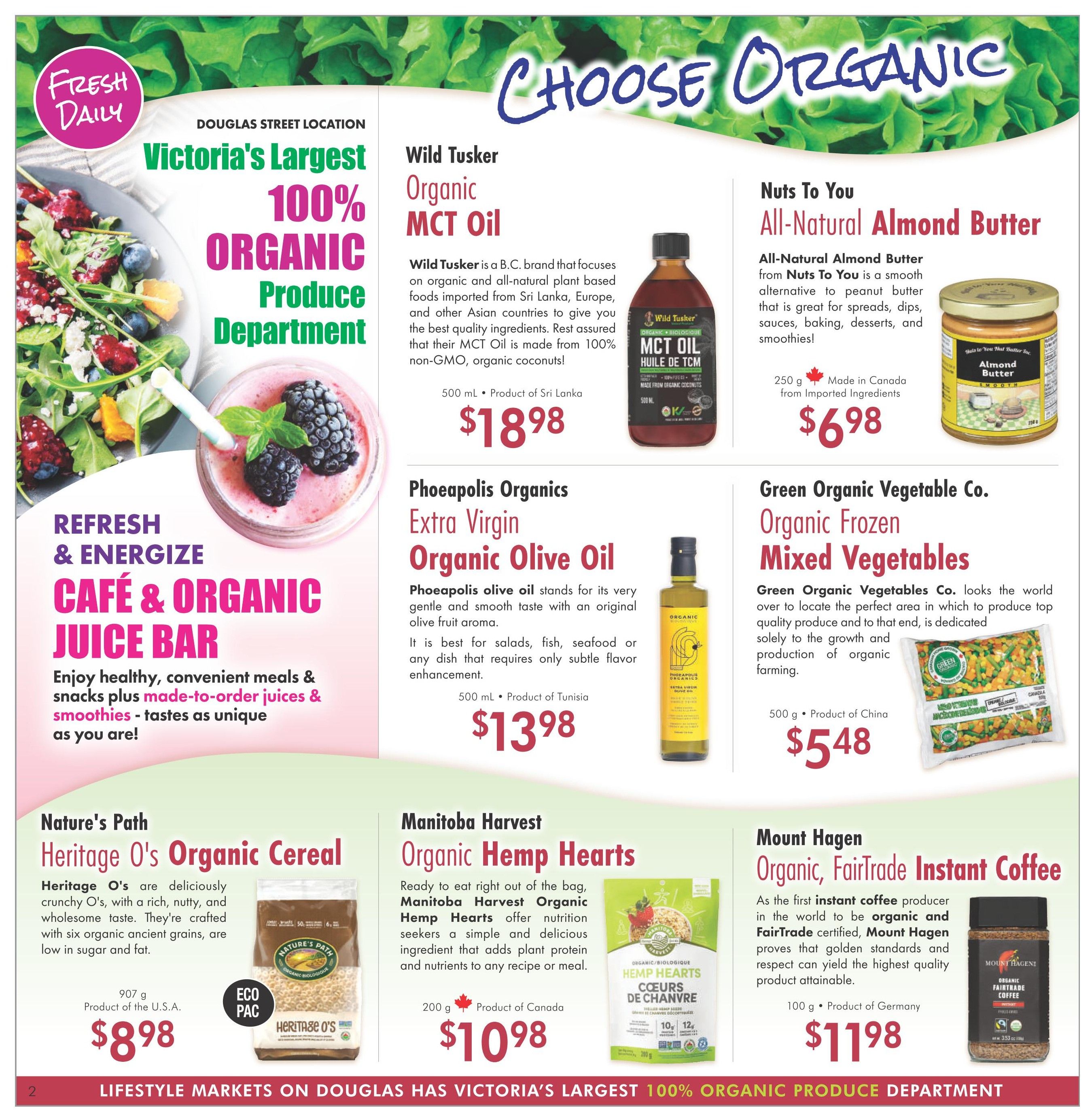 Lifestyle Markets flyer page 2 features 'Choose Organic' with a focus on the Douglas Street location's 100% Organic Produce Department. Refresh & Energize Cafe & Organic Juice Bar offers healthy meals, snacks, juices, and smoothies. Featured organic products include Wild Tusker Organic MCT Oil for $18.98, Nuts To You All-Natural Almond Butter for $6.98, Phoeapolis Organics Extra Virgin Organic Olive Oil for $13.98, Green Organic Vegetable Co. Organic Frozen Mixed Vegetables for $5.48, Nature's Path Heritage O's Organic Cereal for $8.98, Manitoba Harvest Organic Hemp Hearts for $10.98, and Mount Hagen Organic, FairTrade Instant Coffee for $11.98.