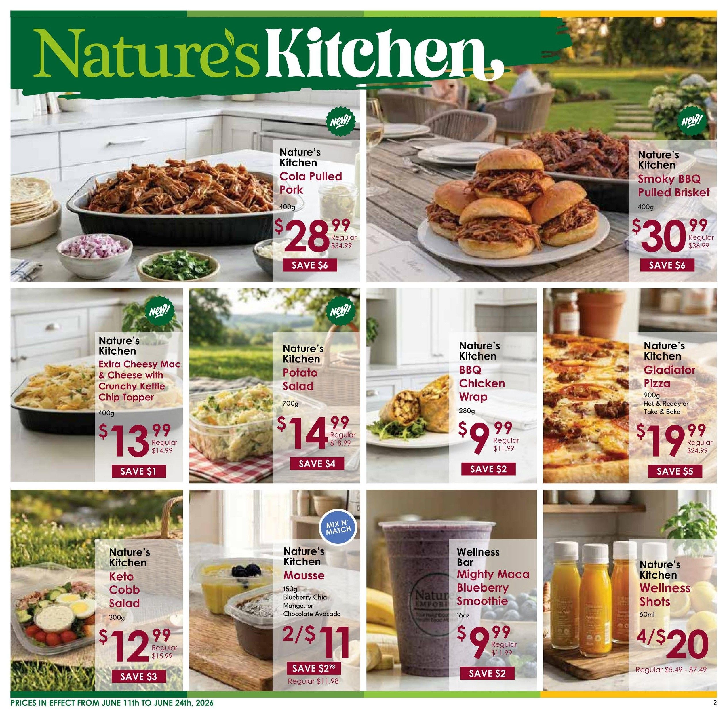 Nature's Emporium flyer page 2 features Nature's Kitchen products. Highlights include Nature's Kitchen Cola Pulled Pork for $28.99 (save $6), Nature's Kitchen Smoky BBQ Pulled Brisket for $30.99 (save $6), Nature's Kitchen Extra Cheesy Mac & Cheese with Crunchy Kettle Chip Topper for $13.99 (save $1), Nature's Kitchen Potato Salad for $14.99 (save $4), Nature's Kitchen BBQ Chicken Wrap for $9.99 (save $2), and Nature's Kitchen Gladiator Pizza (Hot & Ready or Take & Bake) for $19.99 (save $5). Also featured are Nature's Kitchen Keto Cobb Salad for $12.99 (save $3), Nature's Kitchen Mousse (Blueberry Chia, Mango, or Chocolate Avocado) at 2 for $11 (save $2.98), Wellness Bar Mighty Maca Blueberry Smoothie for $9.99 (save $2), and Nature's Kitchen Wellness Shots for 4 for $20 (regular $5.49 - $7.49). Prices are effective from June 11th to June 24th, 2026.