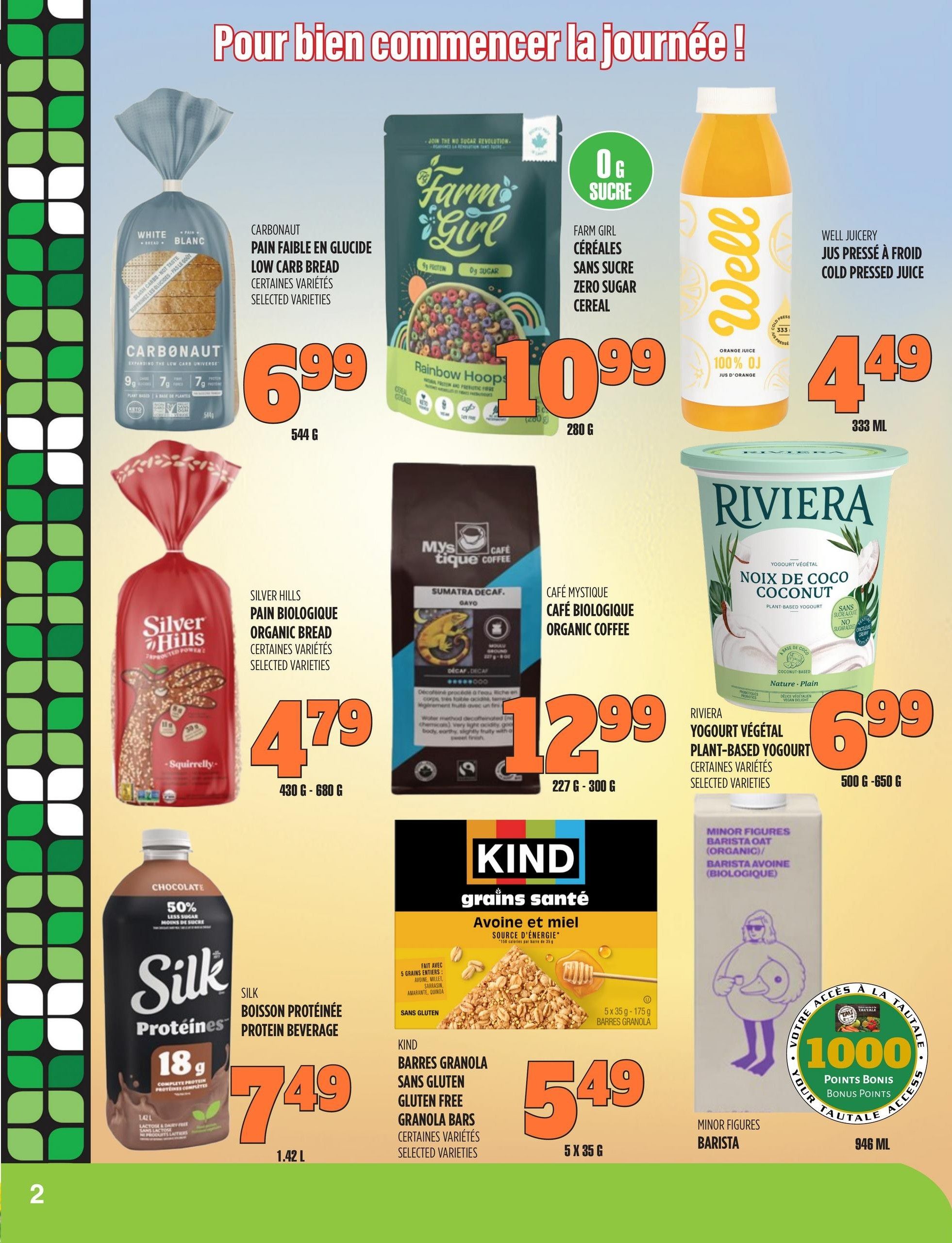 Marches TAU flyer page 2 features a selection of breakfast and beverage items. Carbonaut Low Carb Bread is on sale for $6.99 for 544g. Farm Girl Zero Sugar Rainbow Hoops cereal is $10.99 for 280g. Well Juicery Cold Pressed Juice is $4.49 for 333ml. Silver Hills Organic Bread is $4.79 for 430g-680g. Cafe Mystique Organic Coffee, Sumatra Decaf, is $12.99 for 227g-300g. Silk Protein Beverage in Chocolate flavour is $7.49 for 1.42L. Kind Gluten Free Granola Bars, Oat & Honey flavour, are $5.49 for 5x35g. Riviera Plant-Based Coconut Yogurt is $6.99 for 500g-650g. Minor Figures Barista Oat (Organic) is available in a 946ml size and offers 1000 Tautale Bonus Points.