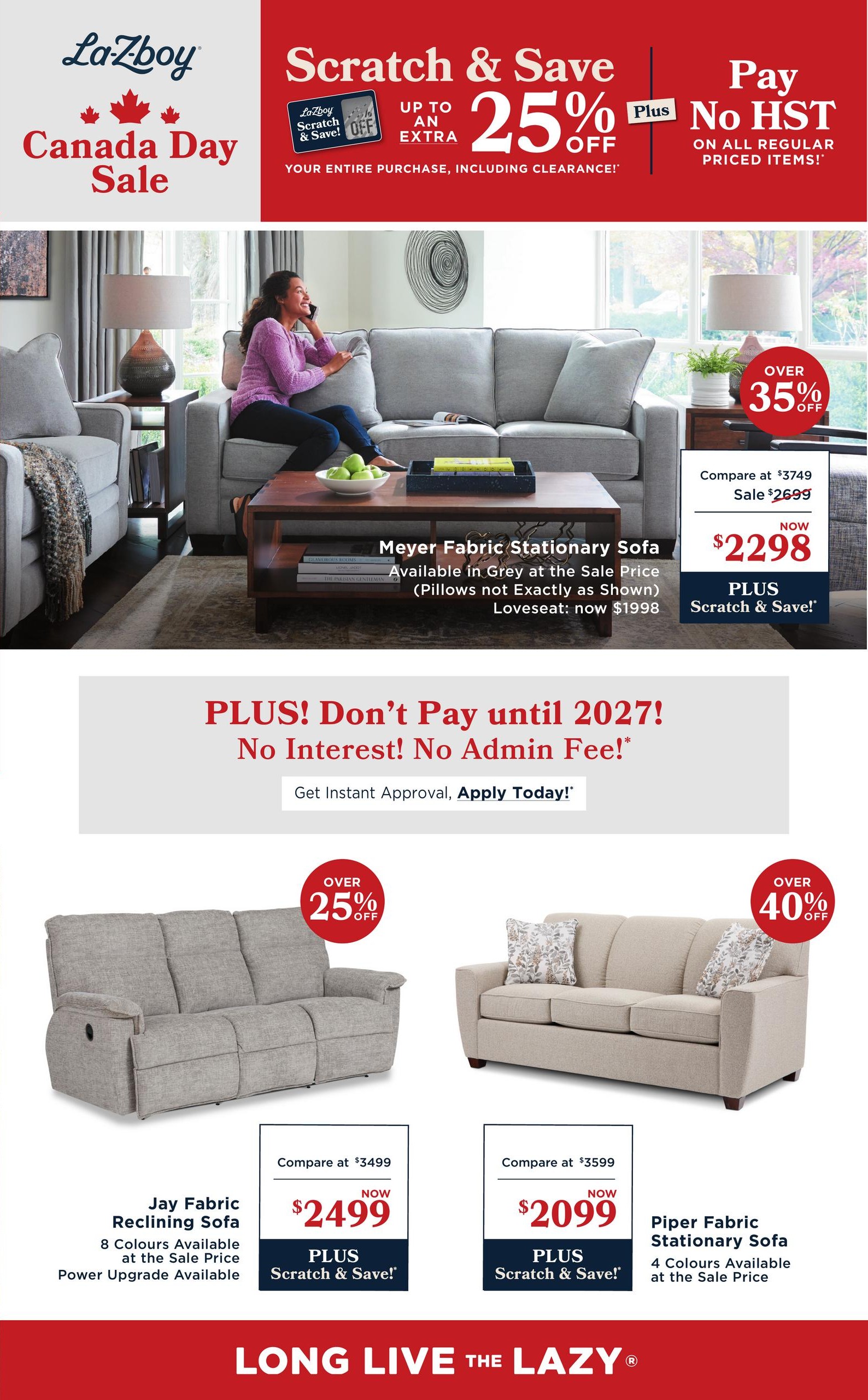 La-Z-Boy Canada Day Sale flyer, page 2. Features a 'Scratch & Save' promotion offering up to an extra 25% off your entire purchase, including clearance items, plus pay no HST on all regular priced items. A Meyer Fabric Stationary Sofa is shown, available in Grey, priced at $2298, down from $2699, with a 35% off offer. The loveseat version is now $1998. Below, the Jay Fabric Reclining Sofa is on sale for $2499, down from $3499, with 8 colours available and power upgrade option. The Piper Fabric Stationary Sofa is available for $2099, down from $3599, in 4 colours. A financing offer is also highlighted: 'PLUS! Don't Pay until 2027! No Interest! No Admin Fee!' with instant approval available.