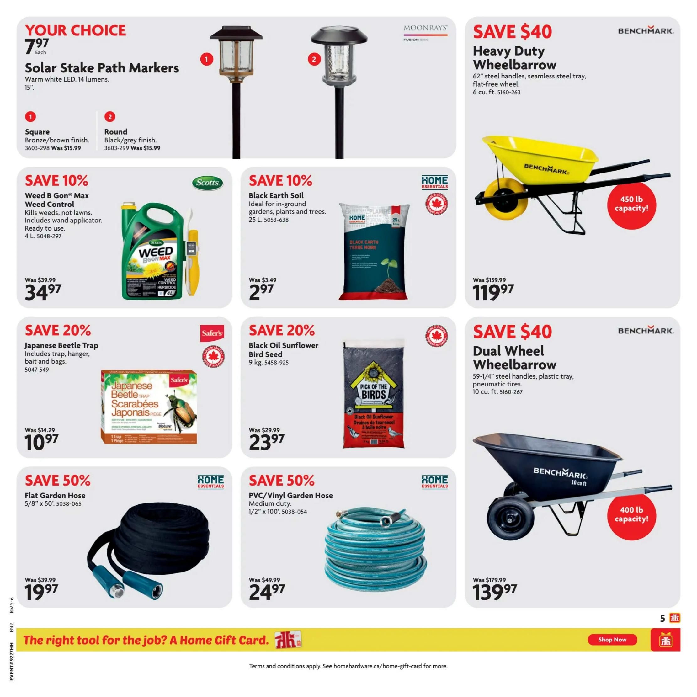 Home Hardware flyer page 6 features 'Your Choice' Solar Stake Path Markers for $7.97 each, available in square (bronze/brown finish) and round (black/grey finish). Save 10% on Scotts Weed B Gon Max Weed Control, 4 L, now $34.97 (was $39.99). Also save 10% on Home Essentials Black Earth Soil, 25 L, for $2.97 (was $3.49). Save 20% on Safer's Japanese Beetle Trap, including trap, hanger, bait, and bags, for $10.97 (was $14.29). Save 20% on Pick of the Birds Black Oil Sunflower Bird Seed, 9 kg, for $23.97 (was $29.99). Save $40 on a Benchmark Heavy Duty Wheelbarrow with 6 cu. ft. capacity, now $119.97 (was $159.99). Save $40 on a Benchmark Dual Wheel Wheelbarrow with 10 cu. ft. capacity and pneumatic tires, now $139.97 (was $179.99). Save 50% on Home Essentials Flat Garden Hose, 5/8' x 50', for $19.97 (was $39.99). Save 50% on Home Essentials PVC/Vinyl Garden Hose, 1/2' x 100', for $24.97 (was $49.99). The bottom banner promotes 'The right tool for the job? A Home Gift Card.' with a 'Shop Now' button.