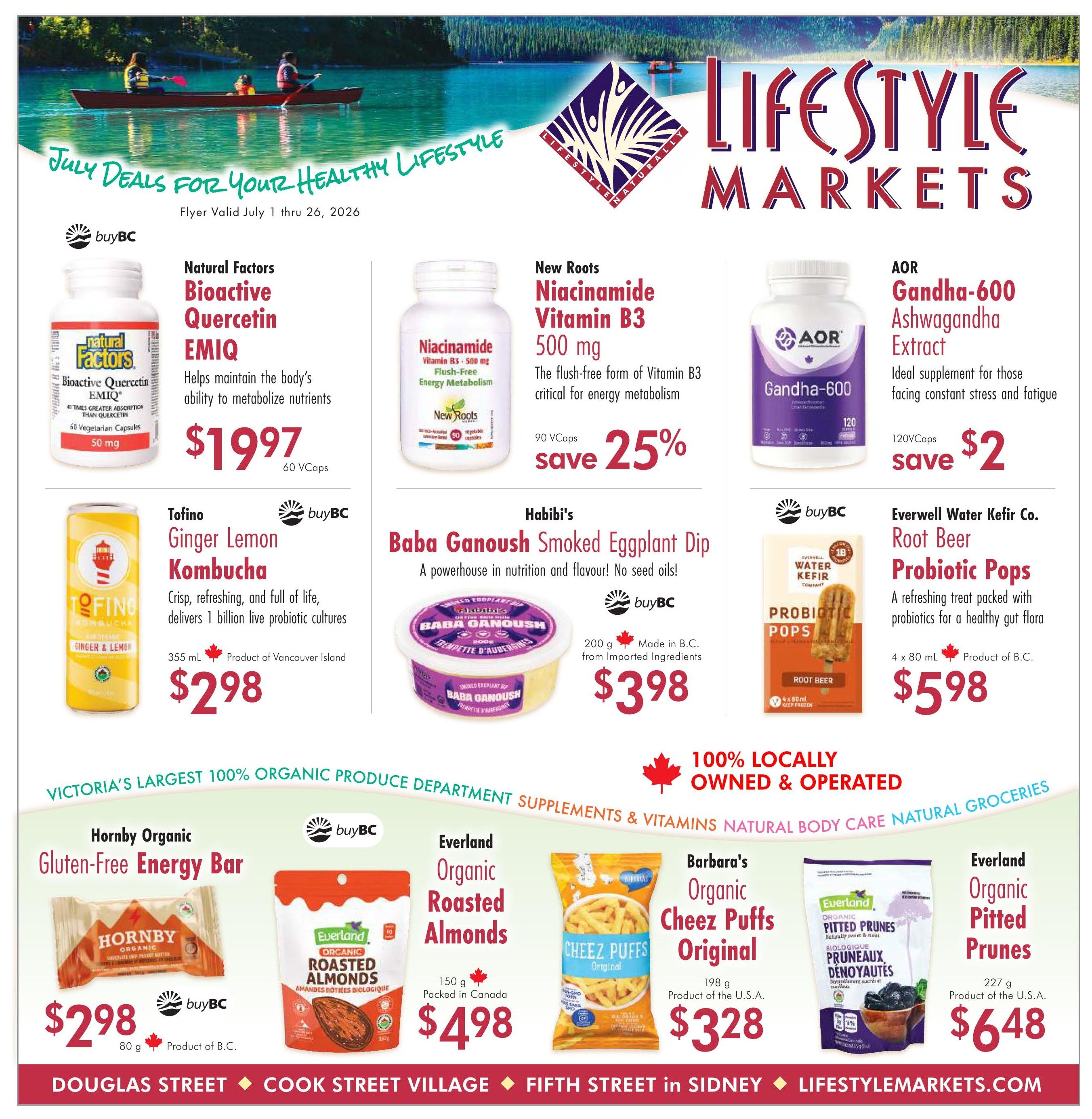 Lifestyle Markets flyer for July 1-26, 2026. Features Natural Factors Bioactive Quercetin EMIQ for $19.97, New Roots Niacinamide Vitamin B3 500 mg on sale for 25% off, and AOR Gandha-600 Ashwagandha Extract for $2. Tofino Ginger Lemon Kombucha is $2.98. Habibi's Baba Ganoush Smoked Eggplant Dip is $3.98. Everwell Water Kefir Co. Root Beer Probiotic Pops are $5.98. Also featured are Hornby Organic Gluten-Free Energy Bars for $2.98, Everland Organic Roasted Almonds for $4.98, Barbara's Organic Cheez Puffs Original for $3.28, and Everland Organic Pitted Prunes for $6.48. The flyer highlights Victoria's largest 100% organic produce department, supplements, vitamins, natural body care, and natural groceries, with many products being 100% locally owned and operated.
