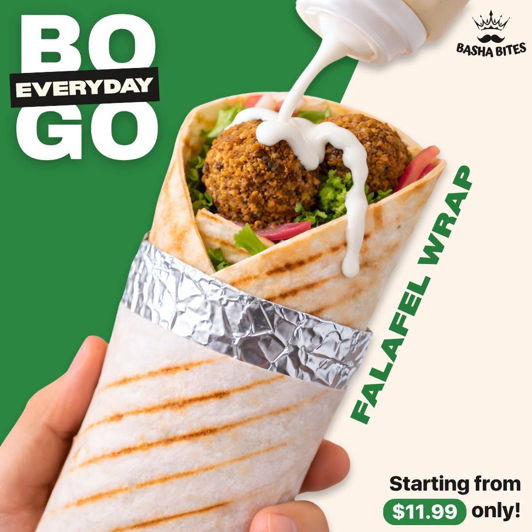 Basha Foods International flyer page 12 features a 'BO EVERYDAY GO' promotion for Falafel Wraps. The image shows a close-up of a falafel wrap being drizzled with sauce, with the text 'FALAFEL WRAP' prominently displayed. The promotion starts from $11.99 only.