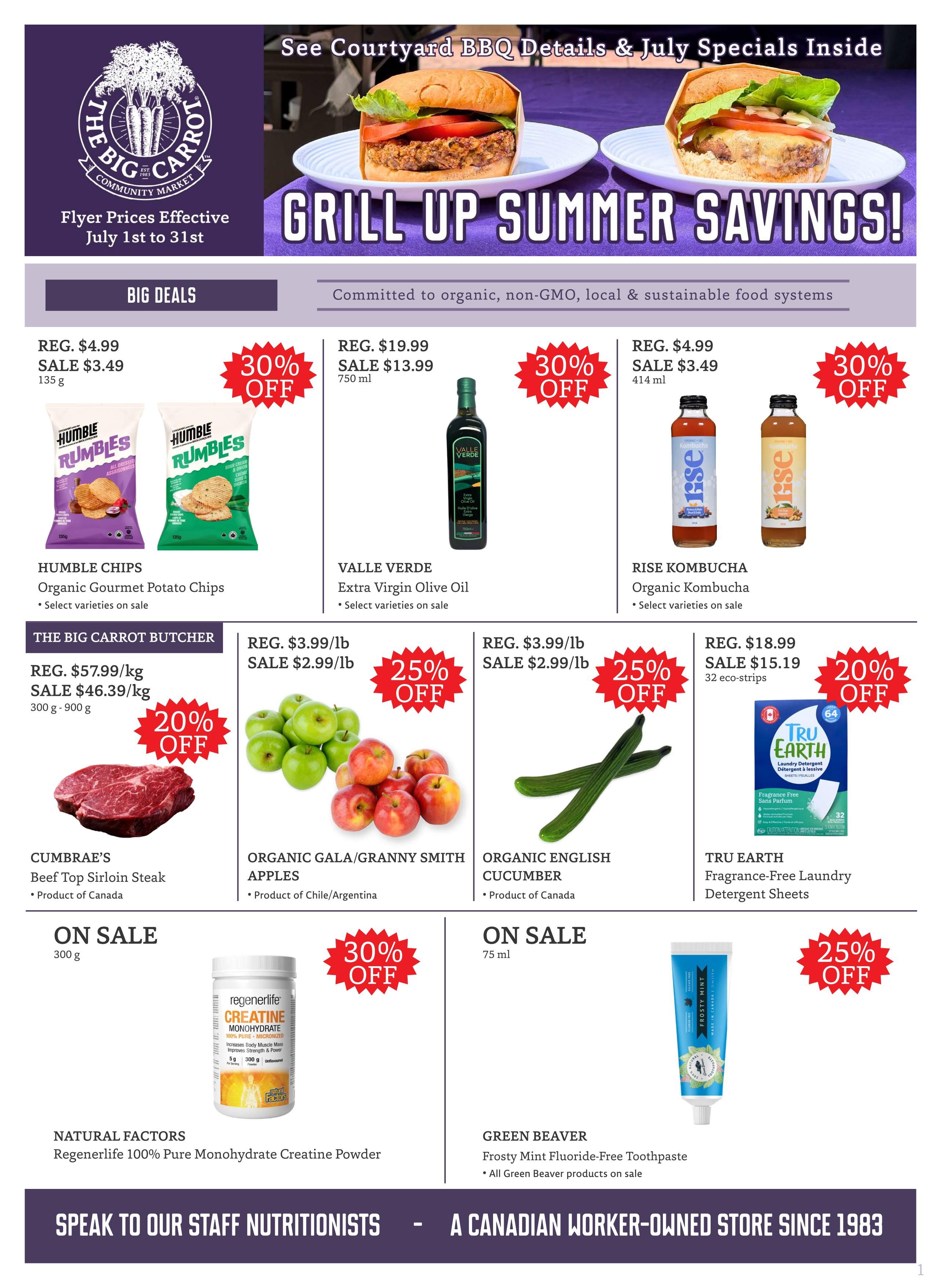 The Big Carrot Community Market flyer featuring 'Grill Up Summer Savings!' with prices effective July 1st to 31st. Big Deals include Humble Chips Organic Gourmet Potato Chips on sale for $3.49 (regular $4.99) with 30% off, and Valle Verde Extra Virgin Olive Oil on sale for $13.99 (regular $19.99) with 30% off. Rise Kombucha is on sale for $3.49 (regular $4.99) with 30% off. The Big Carrot Butcher offers Beef Top Sirloin Steak on sale for $46.39/kg (regular $57.99/kg), a 20% discount. Organic Gala/Granny Smith Apples are on sale for $2.99/lb (regular $3.99/lb), a 25% discount. Organic English Cucumber is also on sale for $2.99/lb (regular $3.99/lb), a 25% discount. Natural Factors Regenerlife 100% Pure Monohydrate Creatine Powder is on sale with 30% off. Green Beaver Frosty Mint Fluoride-Free Toothpaste is on sale, with all Green Beaver products included. Tru Earth Fragrance-Free Laundry Detergent Sheets (32 eco-strips) are on sale for $15.19 (regular $18.99), a 20% discount. The flyer also highlights 'Speak to our Staff Nutritionists' and 'A Canadian Worker-Owned Store Since 1983.