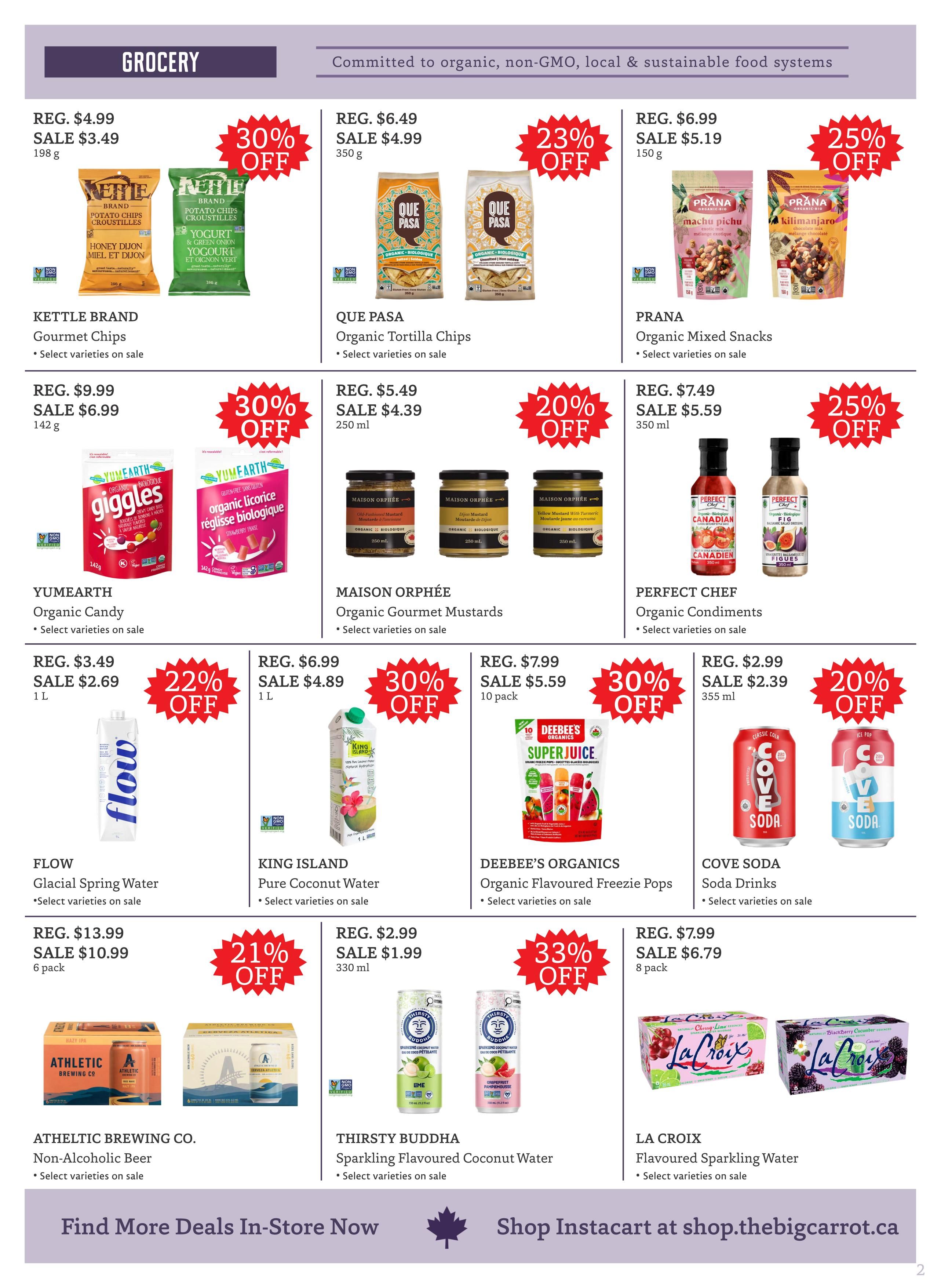 The Big Carrot grocery flyer specials page 2. Featured products include Kettle Brand Gourmet Chips on sale for $3.49 (30% off), Que Pasa Organic Tortilla Chips on sale for $4.99 (23% off), and Prana Organic Mixed Snacks on sale for $5.19 (25% off). Also available are Yumearth Organic Candy for $6.99 (30% off), Maison Orphée Organic Gourmet Mustards for $4.39 (20% off), and Perfect Chef Organic Condiments for $5.59 (25% off). Flow Glacial Spring Water is on sale for $2.69 (22% off), King Island Pure Coconut Water for $4.89 (30% off), Deebee's Organics Organic Flavoured Freezie Pops for $5.59 (30% off), and Cove Soda Drinks for $2.39 (20% off). Athleltic Brewing Co. Non-Alcoholic Beer is on sale for $10.99 (21% off), Thirsty Buddha Sparkling Flavoured Coconut Water for $1.99, and La Croix Flavoured Sparkling Water for $6.79 (33% off). Find more deals in-store or shop Instacart at shop.thebigcarrot.ca.