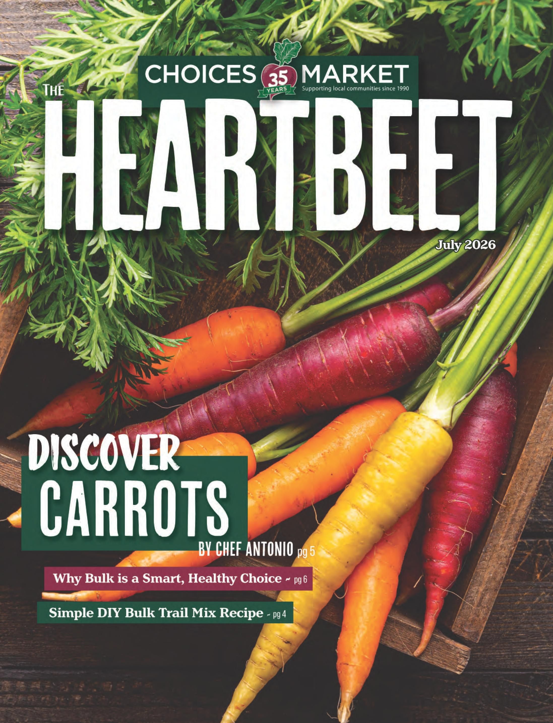 Choices Markets Heartbeet magazine cover for July 2026, featuring a close-up of various colourful carrots in a wooden crate. The cover highlights 'Discover Carrots' and includes articles like 'Why Bulk is a Smart, Healthy Choice' on page 6 and 'Simple DIY Bulk Trail Mix Recipe' on page 4, with content by Chef Antonio on page 5. The magazine celebrates 35 years of supporting local communities since 1990.