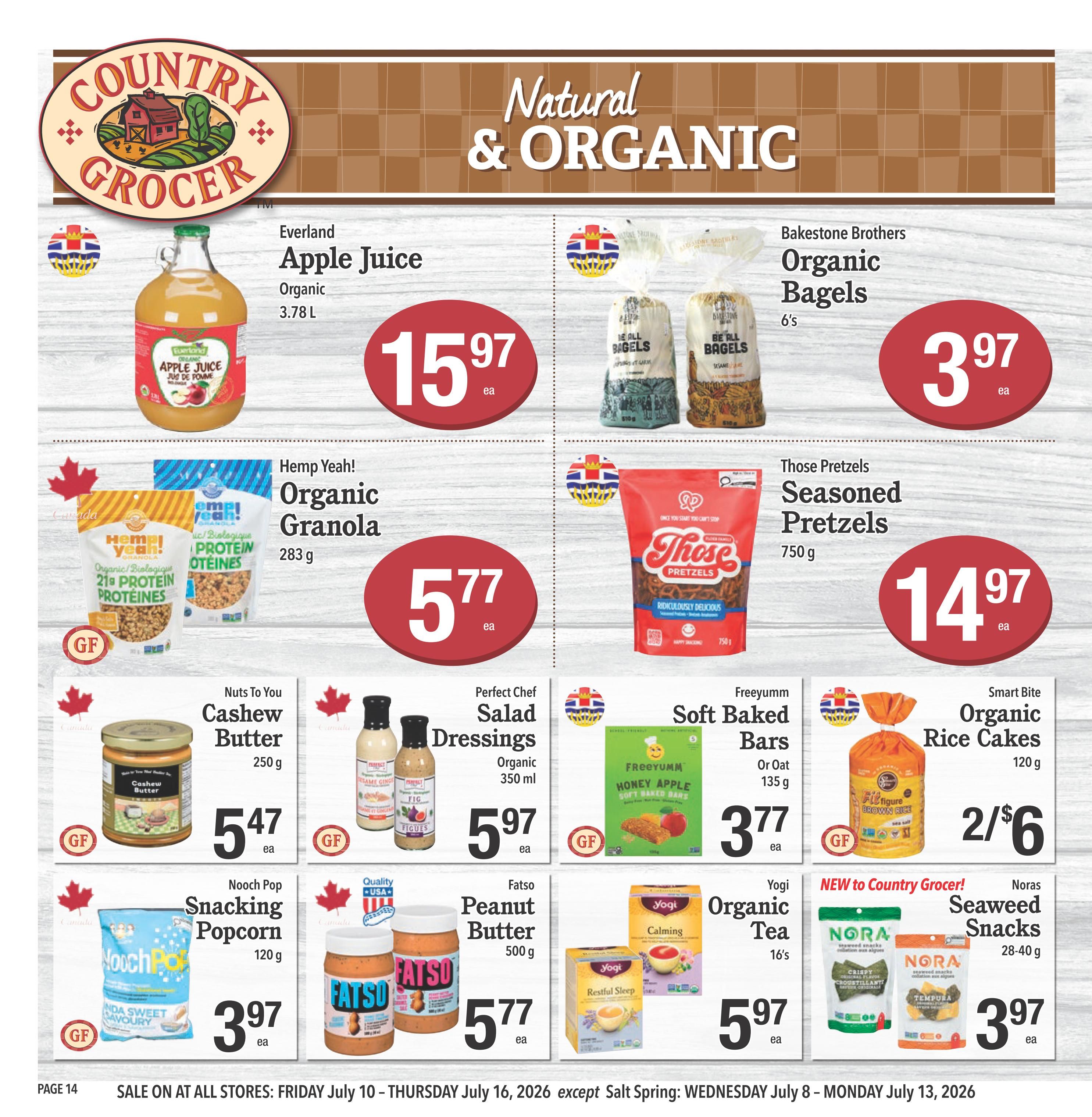 Country Grocer weekly flyer specials page 14 features natural and organic products. Highlights include Everland Organic Apple Juice for $15.97, Bakestone Brothers Organic Bagels for $3.97, and Hemp Yeah! Organic Granola for $5.77. Also featured are Those Pretzels Seasoned Pretzels at $14.97, Nuts To You Cashew Butter for $5.47, Perfect Chef Salad Dressings for $5.97, Freeyumm Soft Baked Bars for $3.77, and Smart Bite Organic Rice Cakes at 2 for $6. New to Country Grocer are Noras Seaweed Snacks for $3.97. Other deals include Nooch Pop Snacking Popcorn for $3.97, Fatso Peanut Butter for $5.77, and Yogi Organic Tea for $5.97. Sale runs Friday July 10 to Thursday July 16, 2026.