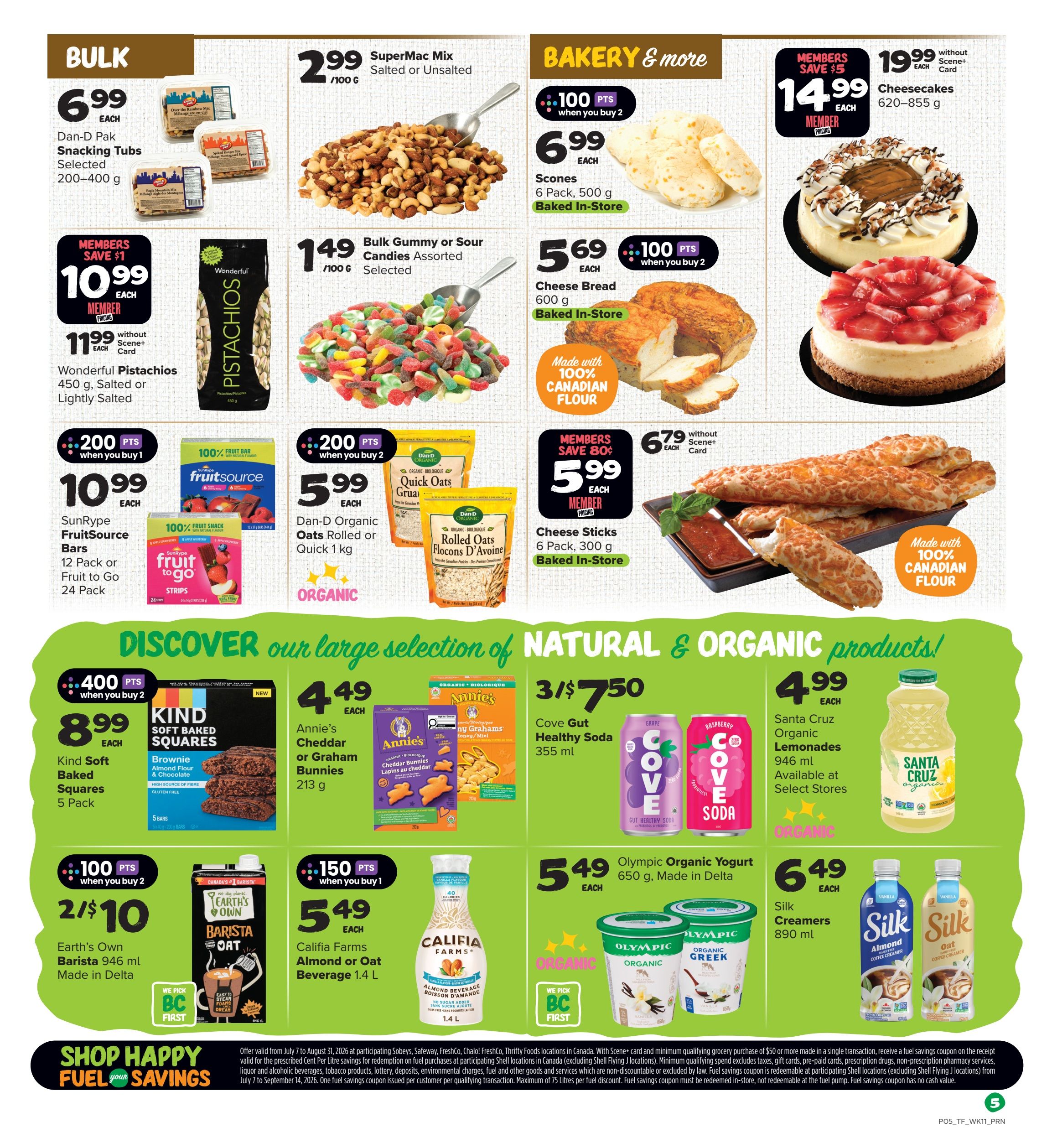 Thrifty Foods weekly flyer specials page 6. Bulk section features Dan-D Pak Snacking Tubs for $6.99, Wonderful Pistachios for $10.99 (member price) or $11.99 (without Scene+ card), and Bulk Gummy or Sour Candies for $1.49. Bakery & More includes SuperMac Mix for $2.99/100g, Scones (6 pack) for $6.99, and Cheesecakes for $14.99 (member price) or $19.99 (without Scene+ card). Also featured are Cheese Bread for $5.69 and Cheese Sticks for $5.99 (member price) or $6.79 (without Scene+ card), both made with 100% Canadian flour. Other deals include SunRipe FruitSource Bars or Fruit to Go for $10.99, Dan-D Organic Oats Rolled or Quick for $5.99, Kind Soft Baked Squares for $8.99, Annie's Cheddar or Graham Bunnies for $4.49, Cove Gut Healthy Soda for 3/$7.50, Santa Cruz Organic Lemonades for $4.99, Earth's Own Barista Oat Milk for 2/$10, Califia Farms Almond or Oat Beverage for $5.49, Olympic Organic Yogurt for $6.49, and Silk Creamers for $6.49. The flyer also promotes 'Shop Happy Fuel your Savings.