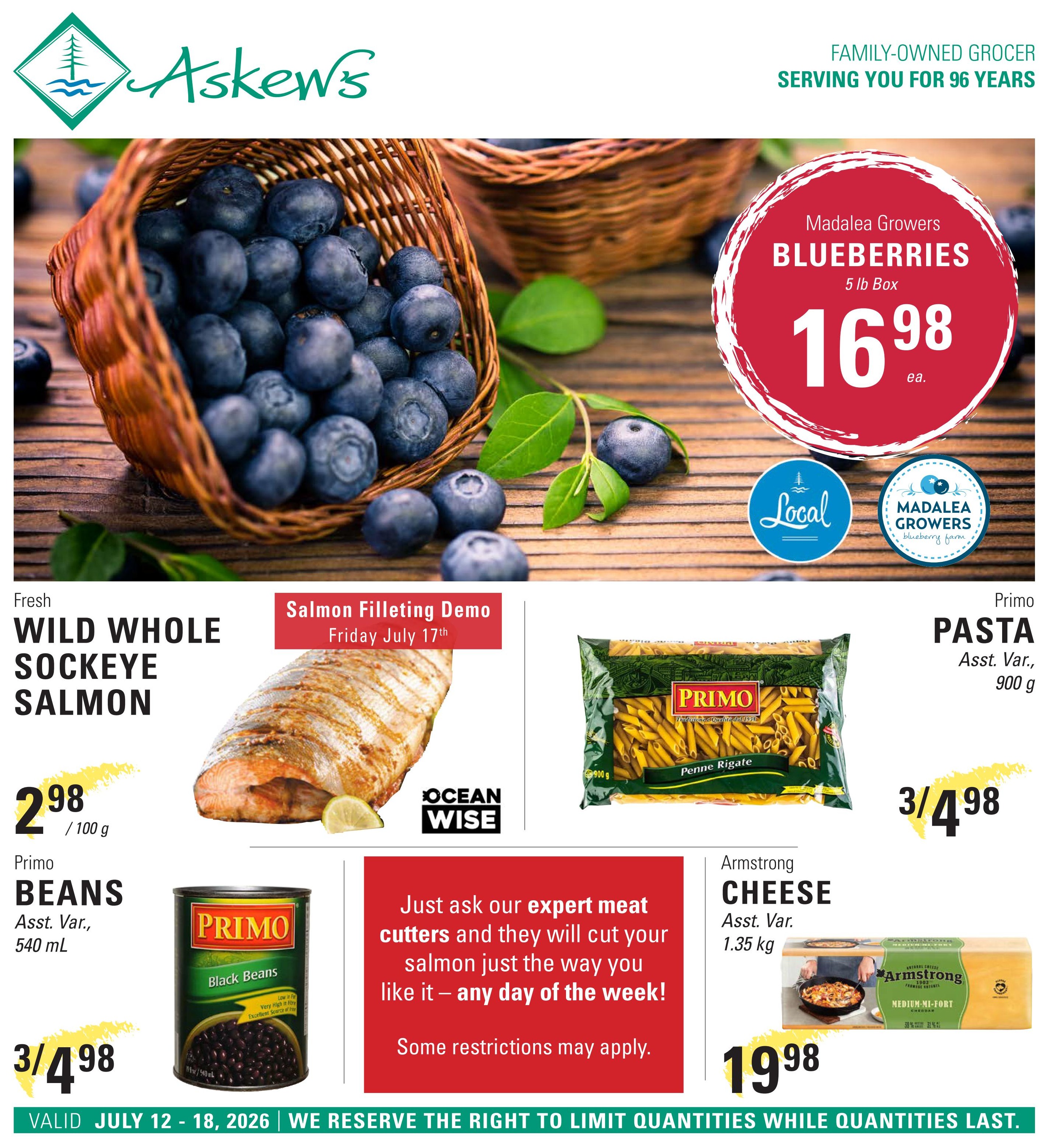 Askew's Foods weekly flyer specials page featuring Madalea Growers Blueberries, 5 lb box for $16.98 each. Fresh Wild Whole Sockeye Salmon is available for $2.98 per 100g, with a salmon filleting demo on Friday, July 17th. Primo Pasta, assorted varieties, 900g, is on sale for 3 for $4.98. Primo Black Beans, assorted varieties, 540 mL, are also priced at 3 for $4.98. Armstrong Cheese, assorted varieties, 1.35 kg, is $19.98. The flyer is valid from July 12 to July 18, 2026.