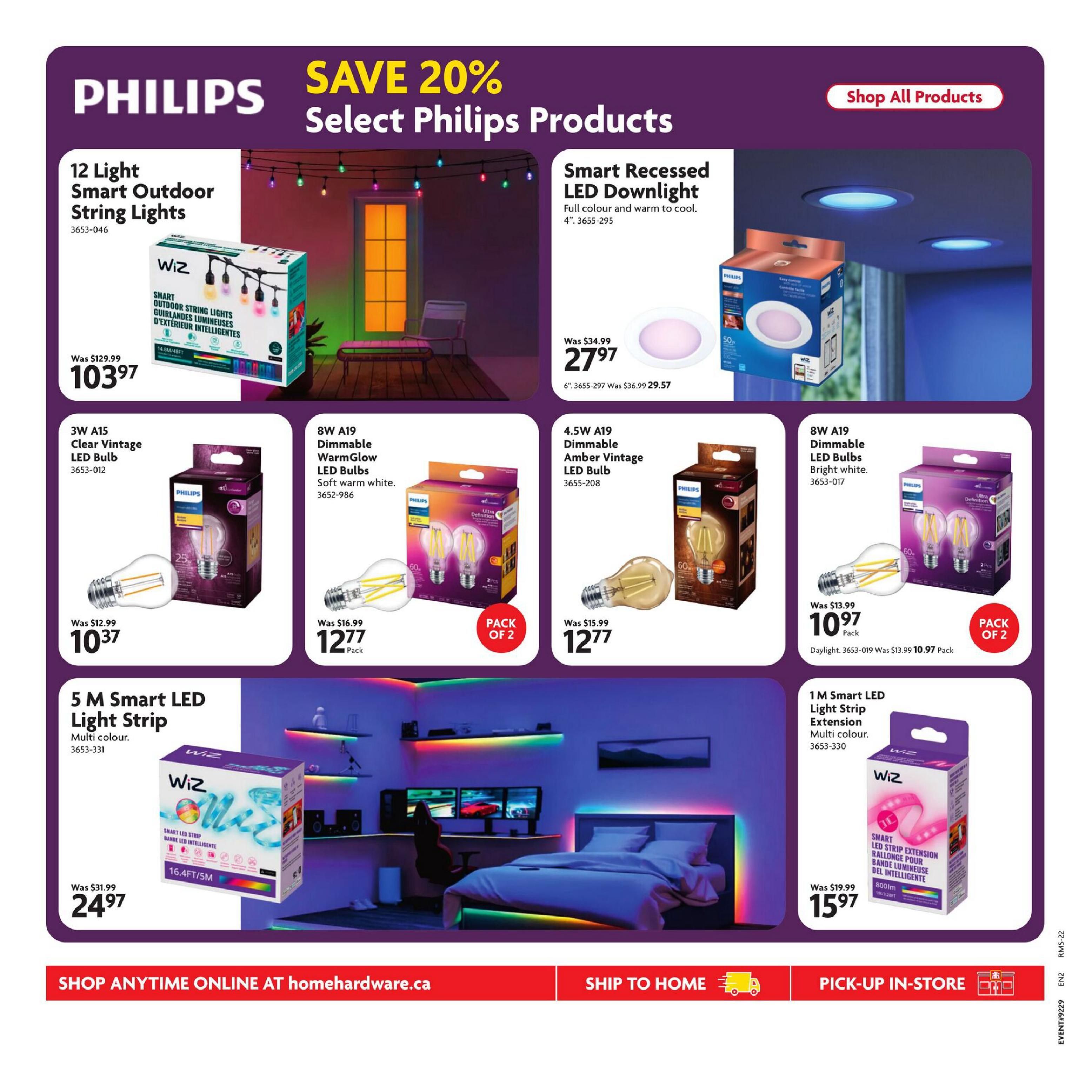 Home Hardware flyer page 29 featuring Philips products with savings up to 20%. Highlighted items include 12 Light Smart Outdoor String Lights for $103.97 (was $129.99), a Smart Recessed LED Downlight for $27.97 (was $34.99), and a 6' Smart Recessed LED Downlight for $29.57 (was $36.99). Also featured are 3W A15 Clear Vintage LED Bulbs for $10.37 (was $12.99), 8W A19 Dimmable WarmGlow LED Bulbs (pack of 2) for $12.77 (was $16.99), and 4.5W A19 Dimmable Amber Vintage LED Bulbs for $12.77 (was $15.99). Additionally, a 1M Smart LED Light Strip Extension in multi-colour is available for $15.97 (was $19.99), and a 5M Smart LED Light Strip in multi-colour is priced at $24.97 (was $31.99). The page also shows 8W A19 Dimmable LED Bulbs in bright white (pack of 2) for $10.97 (was $13.99). Options to shop online at homehardware.ca, ship to home, or pick-up in-store are available.