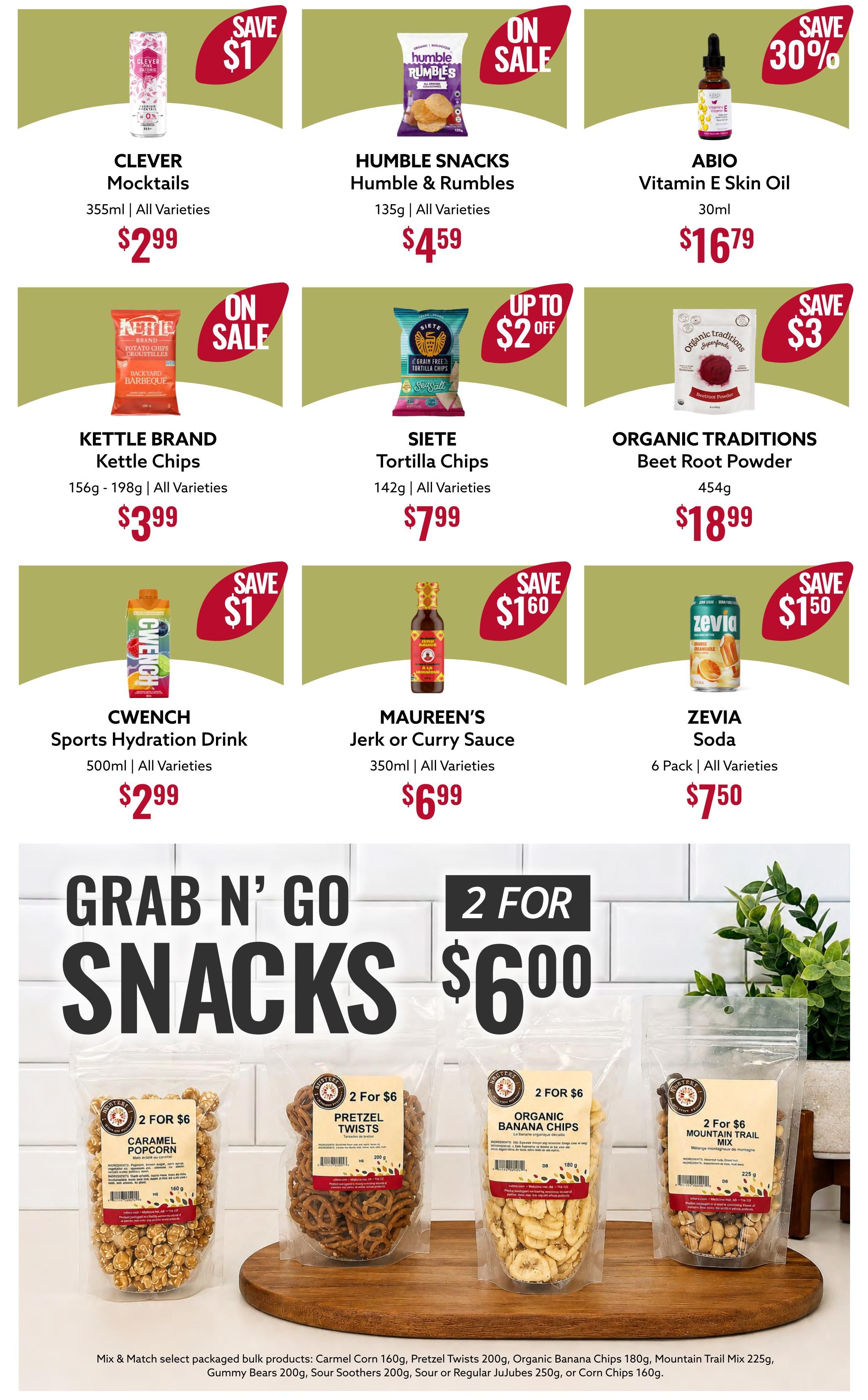 Nutter's Bulk & Natural Foods flyer page 6 featuring various snack and pantry items. Top row includes Clever Mocktails for $2.99 (save $1), Humble Snacks Humble & Rumbles for $4.59 (on sale), and ABIO Vitamin E Skin Oil for $16.79 (save 30%). Middle row features Kettle Brand Kettle Chips for $3.99 (on sale), Siete Tortilla Chips for $7.99 (up to $2 off), and Organic Traditions Beet Root Powder for $18.99 (save $3). Bottom row shows Cwench Sports Hydration Drink for $2.99 (save $1), Maureen's Jerk or Curry Sauce for $6.99 (save $1.60), and Zevia Soda 6 Pack for $7.50 (save $1.50). The bottom section highlights a 'Grab n' Go Snacks' promotion: 2 for $6 on select packaged bulk products including Carmel Corn 160g, Pretzel Twists 200g, Organic Banana Chips 180g, Mountain Trail Mix 225g, Gummy Bears 200g, Sour Soothers 200g, Sour or Regular Jujubes 250g, or Corn Chips 160g.