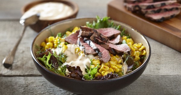 Mixed greens, corn and beef bowl