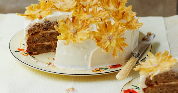 Hummingbird cake topped with pineapple flowers