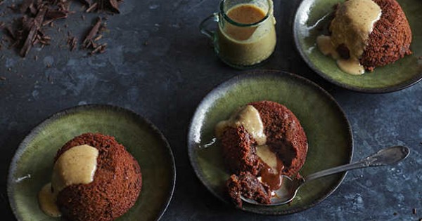 Chocolate and banana molten cakes with hazelnut and date sauce