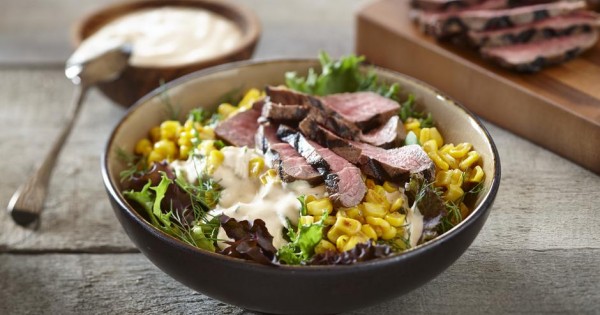 Mixed greens, corn and beef bowl