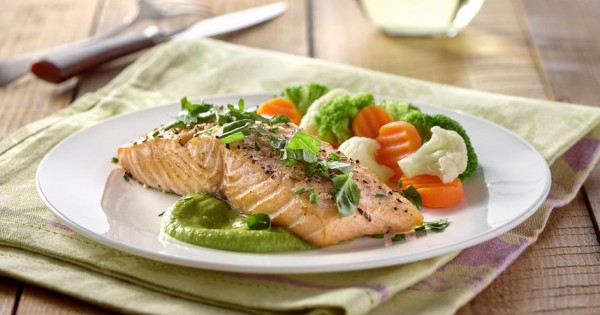 Roasted sesame salmon and pea coulis with garden herbs