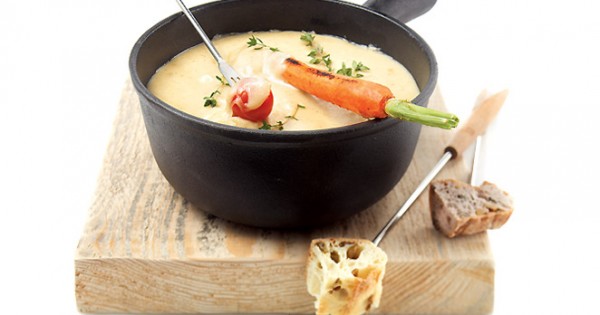 Fondue meal with a tray of grilled vegetables
